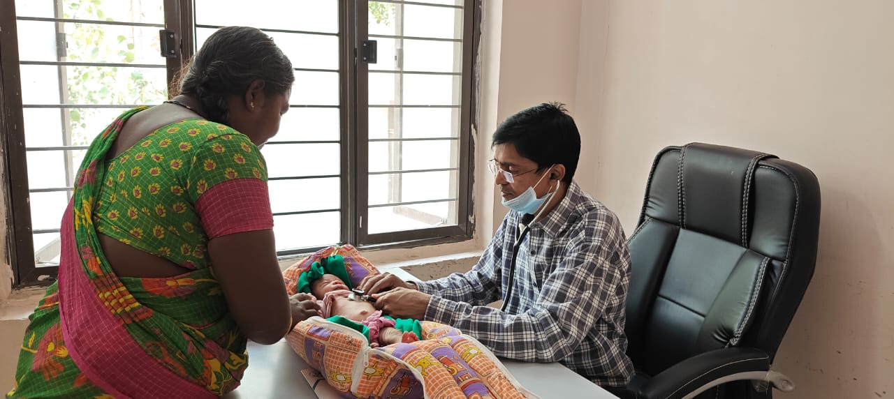 Child checkup by doctor image